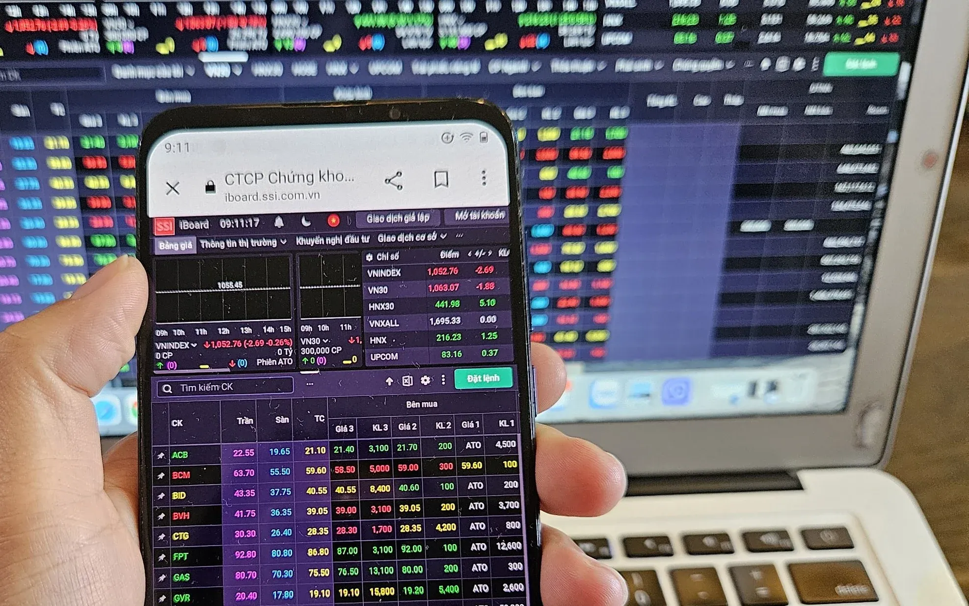 Investor monitoring stock trading board