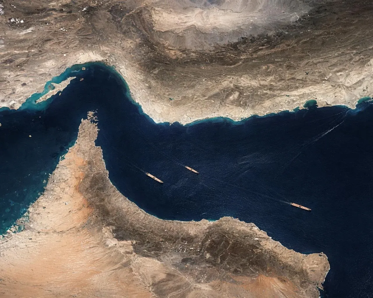 Satellite view of the Strait of Hormuz — the chokepoint carrying a fifth of global energy trade