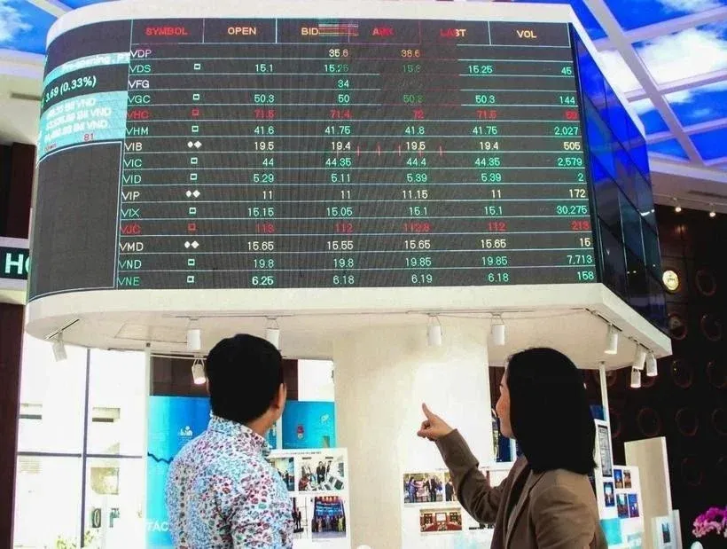 Investors monitoring stock prices at Vietnam's stock exchange