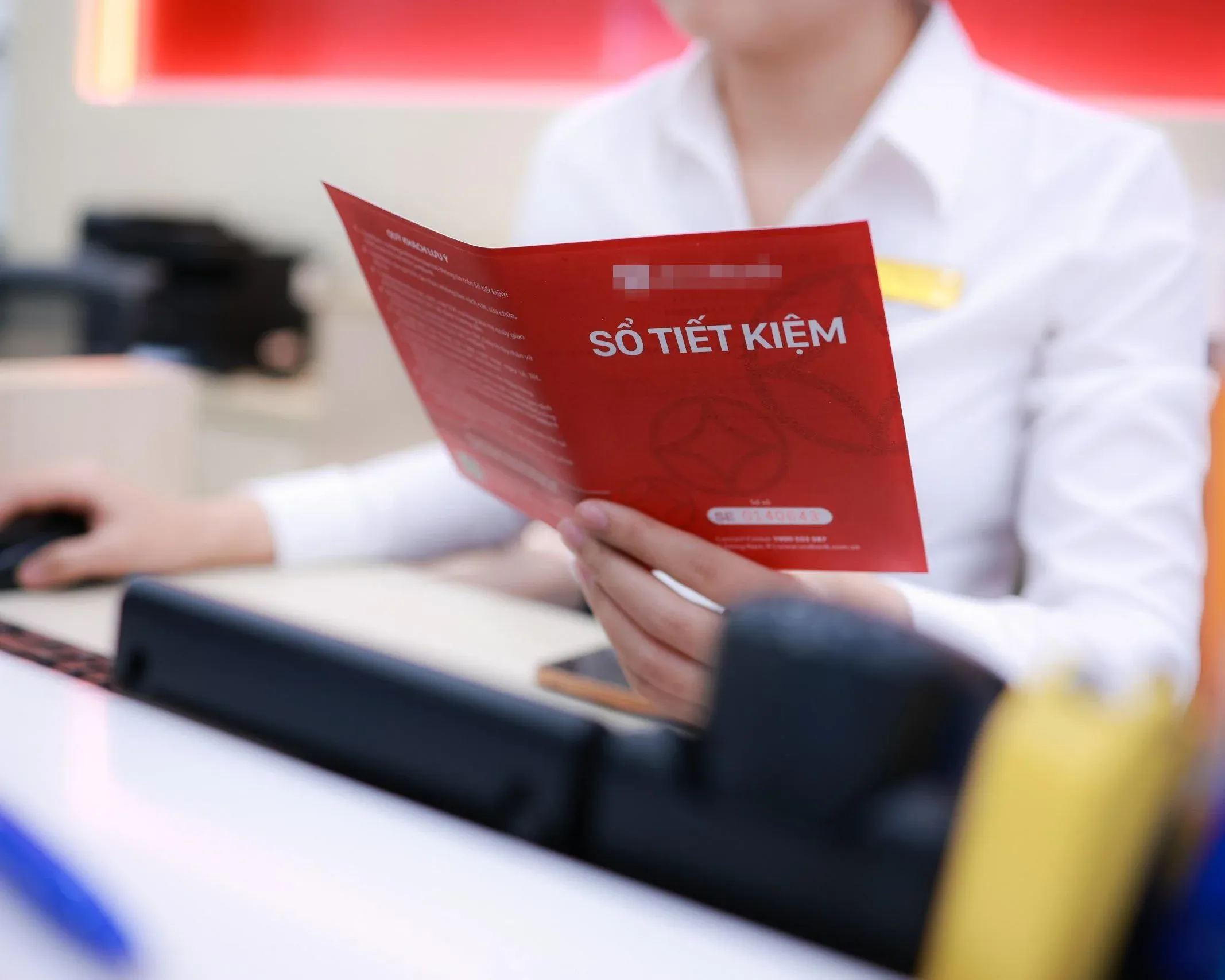 A savings book at the bank counter — time to take another look at your portfolio