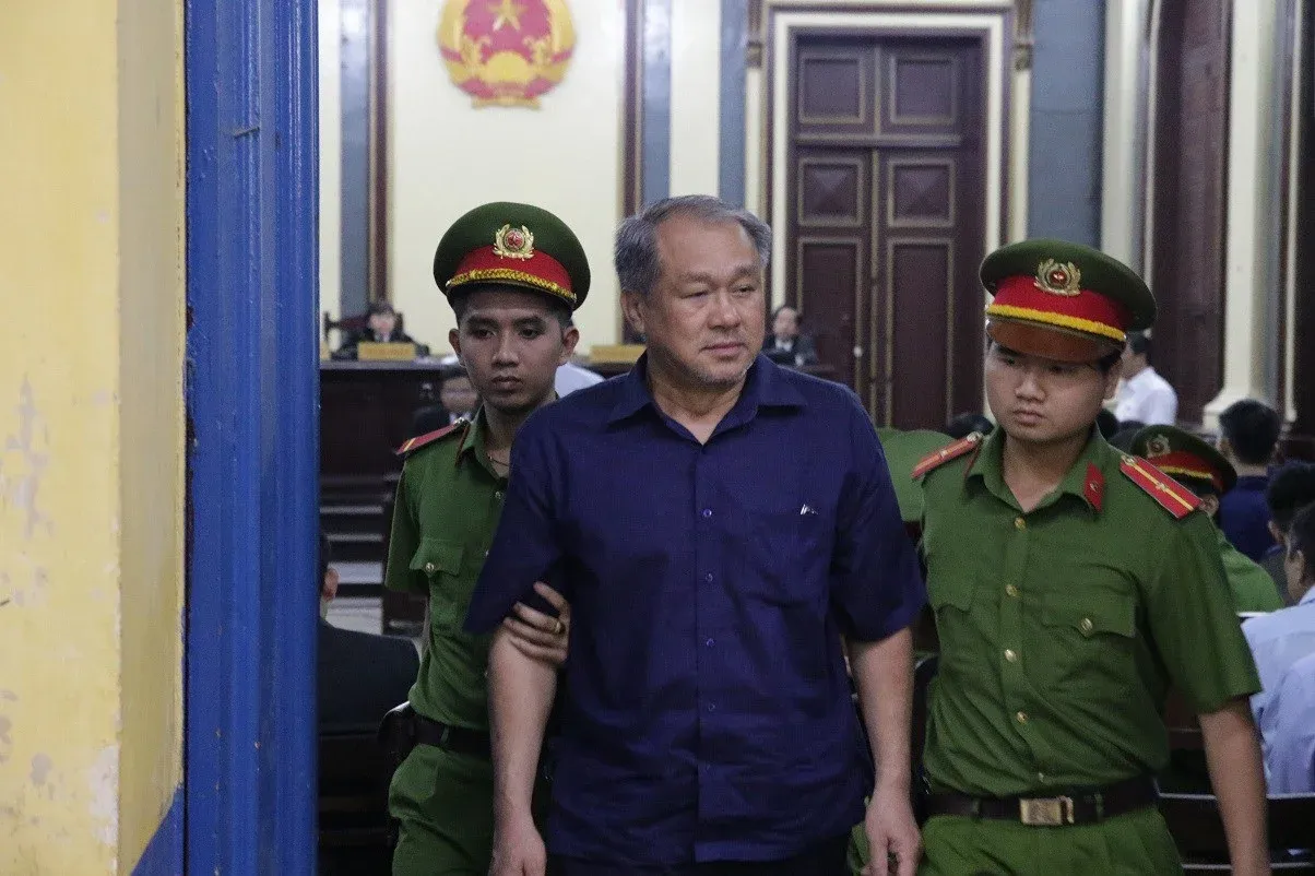 Tram Be being escorted into court